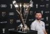 Vancouver Whitecaps' Thomas Muller looks at the MLS Cup trophy during a news conference ahead of the MLS Cup final soccer match, in Fort Lauderdale, Fla., Thursday, Dec. 4, 2025. THE CANADIAN PRESS/Darryl Dyck