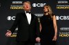 President Donald Trump and first lady Melania Trump, walk the red carpet before the 48th Kennedy Center Honors, Sunday, Dec. 7, 2025, at the John F. Kennedy Center for the Performing Arts in Washington. (AP Photo/Julia Demaree Nikhinson)