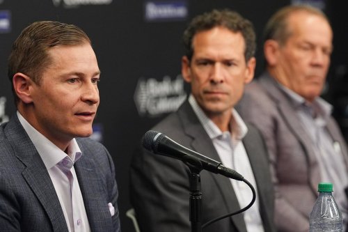 Walker Monfort, left, executive vice president of the Colorado Rockies, responds to a question as Paul DePodesta, the team's new president of baseball operations, center, and Dick Monfort, chairman and chief executive officer, look on during a news conference Thursday, Nov. 13, 2025, in Denver. (AP Photo/David Zalubowski)