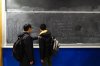 Students work out math problems on the blackboard at University of Toronto after taking part in the William Lowell Putnam Mathematical Competition in Toronto, Saturday, Dec. 6, 2025. THE CANADIAN PRESS/Cole Burston