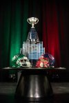 Saskatchewan Roughriders and Montreal Alouettes helmets in front of the Grey Cup during the Grey Cup head coaches' media conference in Winnipeg, Tuesday, Nov. 11, 2025. The Alouettes and Roughriders are set to to play the 112th Grey Cup on Dec. 16. THE CANADIAN PRESS/David Lipnowski