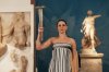 Actress Mary Mina playing the role of high priestess performs during the final rehearsal ahead of the flame lighting for the Milan Cortina 2026 Winter Olympics, at the archaeological museum of Olympia, Greece, Tuesday, Nov. 25, 2025. (AP Photo/Thanassis Stavrakis)
