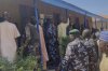 Police and government officials gather at St. Mary's Catholic Primary and Secondary School where gunmen on Friday abducted children and staff in Papiri community, Nigeria, Tuesday, Nov.25, 2025. (AP Photo/Yunusa Umar )