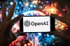FILE - The OpenAI logo is seen displayed on a cell phone in front of an image on a computer screen generated by ChatGPT's Dall-E text-to-image model, Friday, Dec. 8, 2023, in Boston. (AP Photo/Michael Dwyer, file)