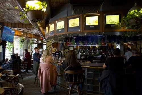Customers at Imperial Pub in downtown Toronto on Friday Nov. 14, 2025. The historic Imperial Pub, located near Sankofa Square in Toronto, is closing after more than eight decades of business. THE CANADIAN PRESS/Doug Ives