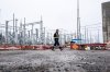 A worker walks in the BC Hydro Skeena Substation while under construction in Terrace, B.C., on Thursday, Nov. 13, 2025. THE CANADIAN PRESS/Ethan Cairns