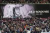 A giant screen displays a Wast Ham legend Billy Bonds died aged 79 prior to the start of the English Premier League soccer match between West Ham United and Liverpool, in London, Sunday, Nov. 30, 2025. (AP Photo/Kirsty Wigglesworth)
