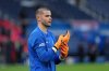 PSG's goalkeeper Lucas Chevalier stands on the pitch prior to the start of the French League One soccer match between Paris Saint Germain and Nice in Paris, Saturday, Nov. 1, 2025. (AP Photo/Aurelien Morissard)