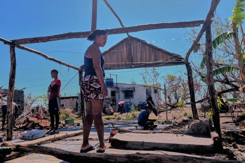 Elizandra Sorrilla poses for a photo in the ruins of her home, which was destroyed by Hurricane Melissa, in El Aserradero, Cuba, Sunday, Nov. 16, 2025. (AP Photo/Milexsy Duran)