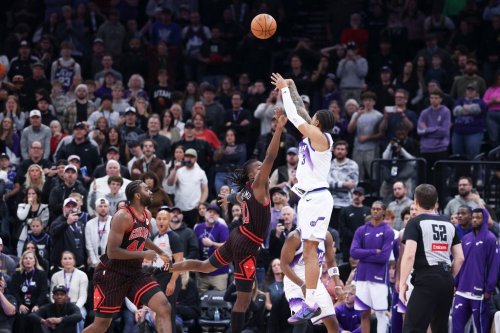 Utah Jazz guard Keyonte George (3) makes a three-point basket over Chicago Bulls guard Ayo Dosunmu to take the lead in the last seconds of the second overtime of an NBA basketball game, Sunday, Nov. 16, 2025, in Salt Lake City. (AP Photo/Rob Gray)