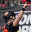 B.C. Lions quarterback Nathan Rourke celebrates his touchdown against the Calgary Stampeders during the second half of the CFL western semifinal football game, in Vancouver, on Saturday, November 1, 2025. THE CANADIAN PRESS/Darryl Dyck