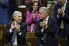 Prime Minister Mark Carney and Minister of Finance and National Revenue Francois-Philippe Champagne applaud following a vote on the federal budget on Parliament Hill in Ottawa, Monday, Nov. 17, 2025. THE CANADIAN PRESS/Adrian Wyld