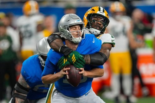 Green Bay Packers defensive lineman Micah Parsons (1) sacks Detroit Lions quarterback Jared Goff (16) during the second half an NFL football game in Detroit, Thursday, Nov. 27, 2025. (AP Photo/Paul Sancya)