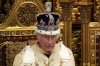 FILE - King Charles III wearing the Crown Jewels attends the State Opening of Parliament in the House of Lords, London, Wednesday, July 17, 2024. (AP Photo/Kirsty Wigglesworth, Pool File)