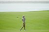 Rasmus Hojgaard of Denmark plays his second shot on the 17th hole during the first round of Abu Dhabi Golf Championship in Abu Dhabi, United Arab Emirates, Thursday, Nov. 6, 2025. (AP Photo/Altaf Qadri)
