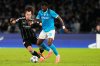 Napoli's Andre-Frank Zambo Anguissa, right, and Frankfurt's Arthur Theate vie for the ball during the Champions League opening phase soccer match between Napoli and Eintracht Frankfurt in Naples, Italy, Tuesday, Nov. 4, 2025. (AP Photo/Gregorio Borgia)