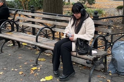 Reyna Dominguez, 18, reads in Union Square Park in Manhattan on Nov. 6, 2025. (AP Photo/Cathy Bussewitz)