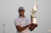 Aaron Rai of England poses with the trophy after winning the Abu Dhabi Golf Championship in Abu Dhabi, United Arab Emirates, Sunday, Nov. 9, 2025. (AP Photo/Altaf Qadri)