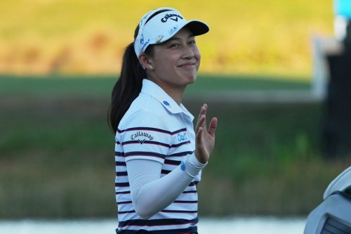 Jeeno Thitikul of Thailand waves as she approaches the 18th green during the third round of the LPGA Tour Championship golf tournament, Saturday, Nov. 22, 2025, in Naples, Fla. (AP Photo/Marta Lavandier)