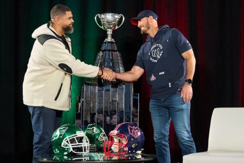 Saskatchewan Roughriders head coach Corey Mace (left) and Montreal Alouettes head coach Jason Maas (right) shake hands before speaking to the media at the Grey Cup head coaches' media conference in Winnipeg, Tuesday, Nov. 11, 2025. The Alouettes and Roughriders are set to to play the 112th Grey Cup on Dec. 16. THE CANADIAN PRESS/David Lipnowski