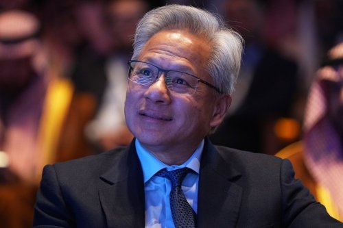 Nvidia CEO Jensen Huang listens as President Donald Trump speaks during the Saudi Investment Forum at the Kennedy Center, Wednesday, Nov. 19, 2025, in Washington. (AP Photo/Evan Vucci)
