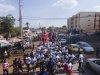 Performers parade with giant marionettes and drums during a street procession at an art festival in Bamako, Mali, on Nov. 6, 2025. (AP Photo/Moustapha Diallo)