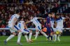 Barcelona's Pedri, center right, vies for the ball surrounded by Alaves players during a Spanish La Liga soccer match between Barcelona and Alaves in Barcelona, Spain, Saturday, Nov. 29, 2025. (AP Photo/Joan Monfort)
