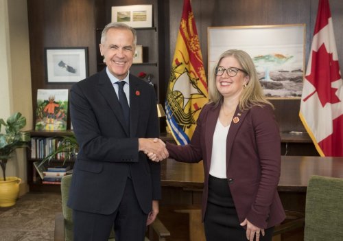 Prime Minister Mark Carney left, meets with New Brunswick Premier Susan Holt in her office in Fredericton, N.B., on Monday, Nov. 10, 2025. THE CANADIAN PRESS/Stephen MacGillivray