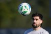 Vancouver Whitecaps' Brian White watches the ball while juggling it with his feet during a training session at Florida International University ahead of the MLS Cup final soccer match, in Miami, Fla., Thursday, Dec. 4, 2025. THE CANADIAN PRESS/Darryl Dyck