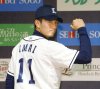Tatsuya Imai wears Seibu Lions' jersey during a news conference in Tokorozawa, Saitama prefecture, Japan, on Dec. 9, 2016. (Kyodo News via AP)