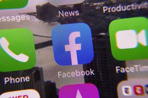 The Facebook app, center, appears on a mobile phone screen on Wednesday, Jan. 25, 2023, in New York. (AP Photo/Richard Drew)
