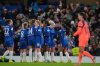 Chelsea's Ellie Carpenter, 2nd right, celebrates after scoring the opening goal during the women's Champions League opening phase soccer match between Chelsea FC and FC Barcelona, in London, Thursday, Nov. 20, 2025. (AP Photo/Kin Cheung)