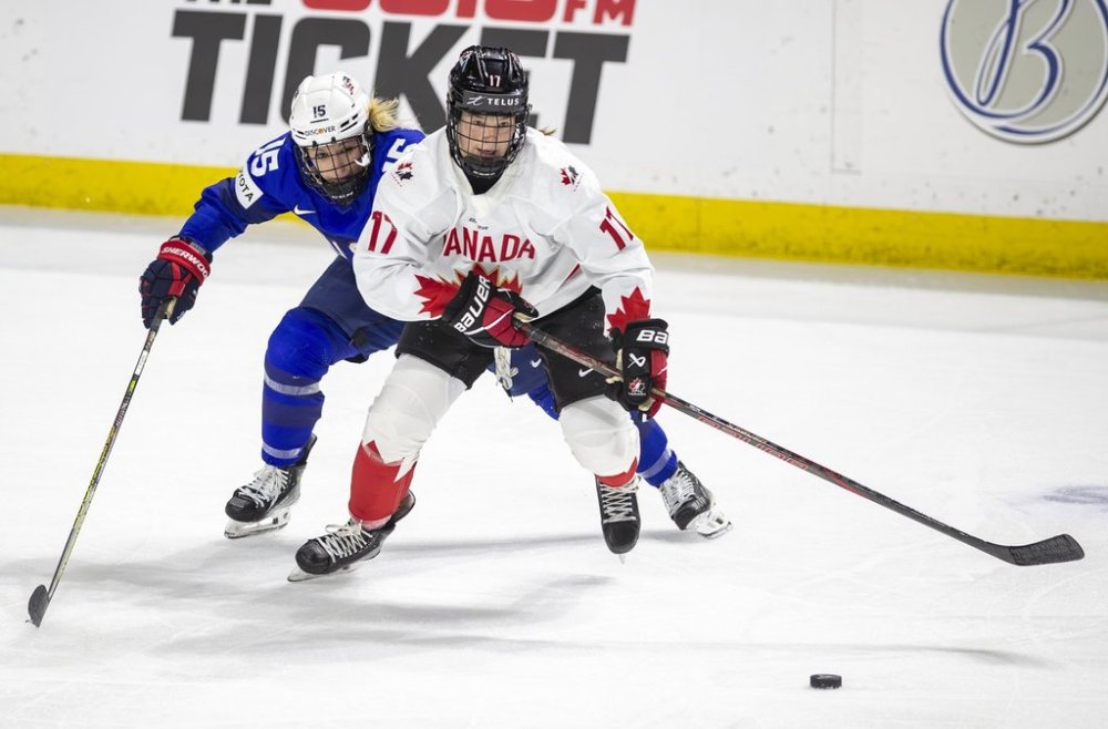 U.S. Savannah Harmon (15) chases Canada's Ella Shelton (17) during the second period of a women's Rivalry Series hockey game at the Idaho Central Arena in Boise, Idaho, Sunday, Nov. 10, 2024. (AP Photo/Kyle Green)