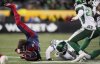Montreal Alouettes' Stevie Scott III (8) is upended by Saskatchewan Roughriders' Micah Johnson (4) during first half CFL football action at the 112th Grey Cup, in Winnipeg on Sunday, Nov. 16, 2025. THE CANADIAN PRESS/Darryl Dyck