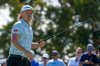 FILE - Australia's Cam Smith reacts as he walks off the 18th green during the first round of the Australian Open Golf Championship in Sydney, Australia, Nov. 30, 2023. (AP Photo/Mark Baker, File)