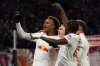 Leipzig's scorer Assan Ouedraogo, left, and his teammates celebrate the opening goal during the German Bundesliga Soccer match between RB Leipzig and Werder Bremen in Leipzig, Germany, Sunday, Nov. 23, 2025. (Jan Woitas/dpa via AP)