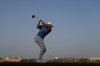 Rory McIlroy of Northern Ireland tees off at xx hole 18th hole during the second round of Abu Dhabi Golf Championship in Abu Dhabi, United Arab Emirates, Friday, Nov. 7, 2025. (AP Photo/Altaf Qadri)