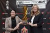Diana Matheson, left, co-founder and chief growth officer of the Northern Super League, and NSL president Christina Litz pose in Toronto, on Thursday, Nov. 13, 2025, next to the Diana B. Matheson Cup, which will be awarded after Saturday's championship game between AFC Toronto and Vancouver Rise FC. THE CANADIAN PRESS/Neil Davidson