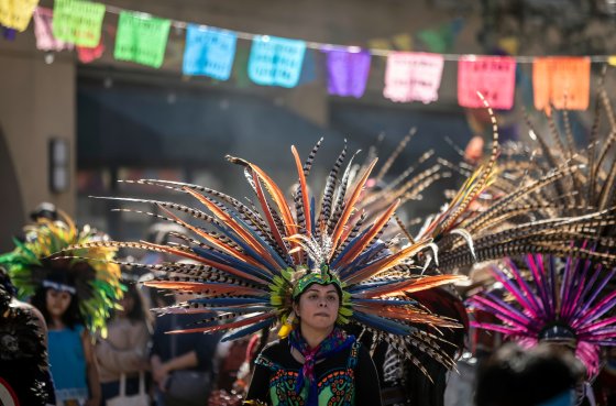 An Indigenous dancer, one of several groups gathered from all over the bay area, performs during Dia De Los Muertos festivities in the Fruitvale district in Oakland, Calif., on Nov. 2. (Carlos Avila Gonzalez/San Francisco Chronicle via The Associated Press)