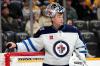 Winnipeg Jets goaltender Eric Comrie looks up at the scoreboard during the second period of an NHL hockey game against the Nashville Predators, Saturday, Nov. 23, 2024, in Nashville, Tenn. (AP Photo/Mark Humphrey)