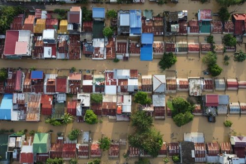 Houses are seen submerged in Ilagan, Isabela province, northern Philippines on Tuesday November 11. 2025 after the onslaught of Typhoon Fung-wong. (AP Photo/Villamor Visaya)