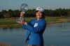 Jeeno Thitikul of Thailand holds the CME Global Trophy for winning the LPGA Tour Championship golf tournament, Sunday, Nov. 23, 2025, in Naples, Fla. (AP Photo/Marta Lavandier)