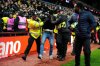 A Young Boys fan is escorted from the stadium by police during the Europa League soccer match between Aston Villa and Young Boys in Birmingham, England, Thursday, Nov. 27, 2025. (Nick Potts/PA via AP)