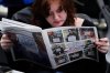 FILE - Columbia College Chicago student Kailey Ryan reads a newspaper in Chicago on Nov. 5, 2024. (AP Photo/Nam Y. Huh, File)