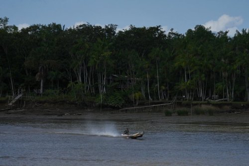 A boat maneuvers near the shore of Barcarena, Brazil, on Sunday, Nov. 9, 2025. (AP Photo/Fernando Llano)