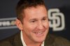 FILE - San Diego Padres general manager Josh Byrnes smiles during a baseball news conference Monday, Oct. 31, 2011 in San Diego. (AP Photo/Lenny Ignelzi)