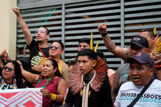 Indigenous peoples shout slogans about defending the Amazon at the People's Summit, a gathering coinciding with the COP30 U.N. Climate Summit. (Fernando Llano / The Associated Press)