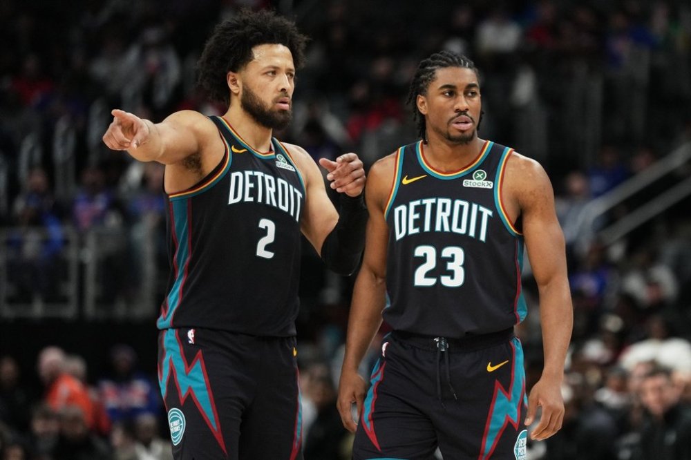 Detroit Pistons guard Cade Cunningham, left, gestures while speaking with guard Jaden Ivey during the second half of an NBA basketball game against the Atlanta Hawks, Monday, Dec. 1, 2025, in Detroit. (AP Photo/Ryan Sun)