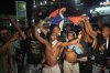 Fans celebrate Haiti's qualification for the 2026 FIFA World Cup after a soccer match against Nicaragua, in Port-au-Prince, Haiti, Tuesday, Nov. 18, 2025. (AP Photo/Odelyn Joseph)