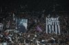 Fans hola a poster of Newcastle's head coach Eddie Howe during a Premier League soccer match between Newcastle United and Manchester City in Newcastle, England, Saturday, Nov. 22, 2025. (AP Photo/Jon Super)